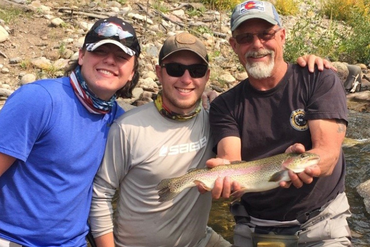 Three men fly fishing for rainbow trout in Colorado