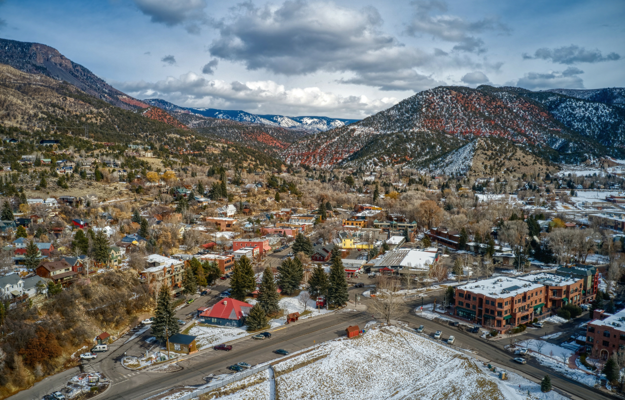 Aerial view of Basalt Colorado in winter with snow in the hills and mountains