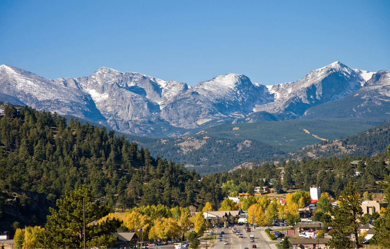 estes park, colorado in fall with snow in the mountains