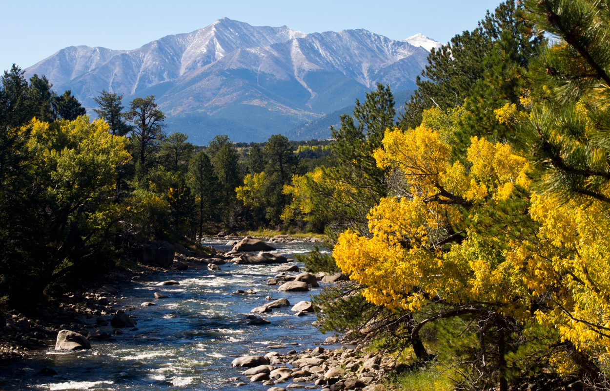 arkansas river, colorado in the fall time with mountains in the background