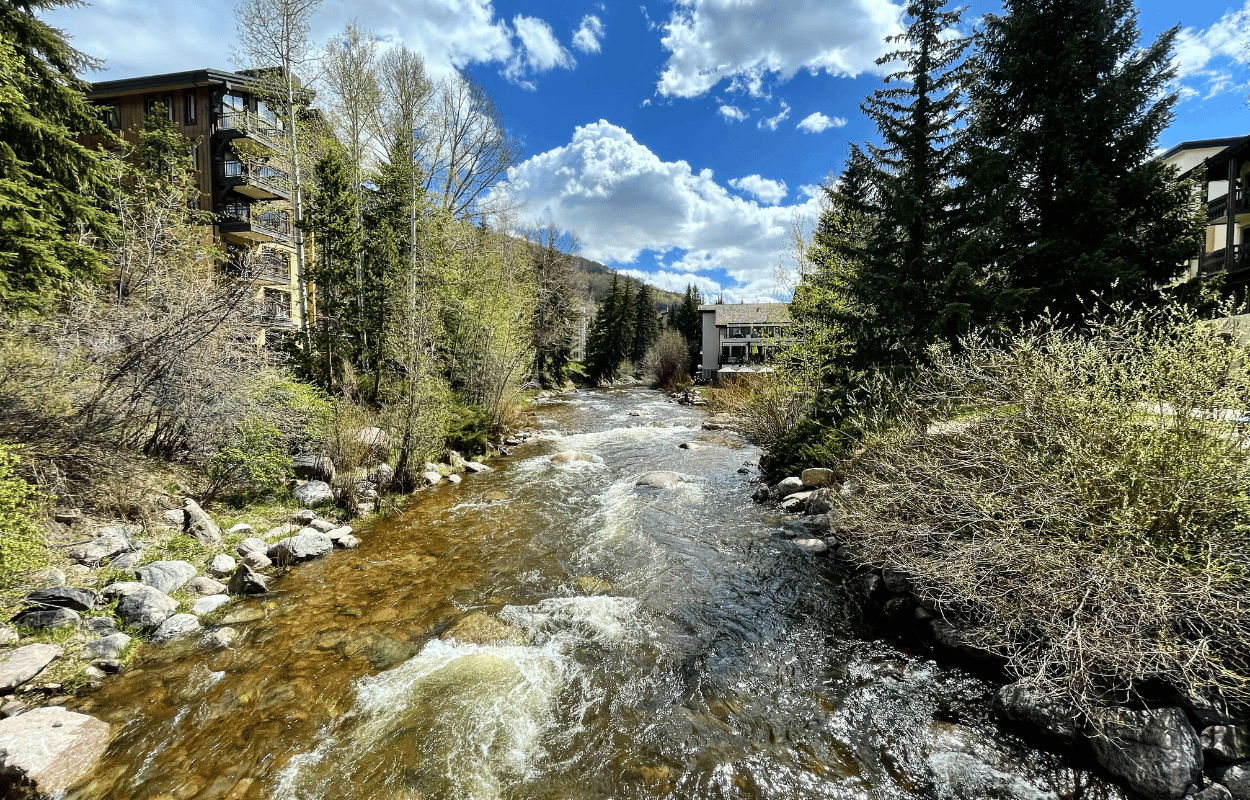 The gold medal waters running through the town of vail.
